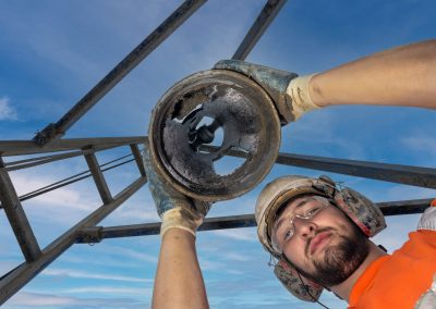 Site worker drilling holes to test the earth
